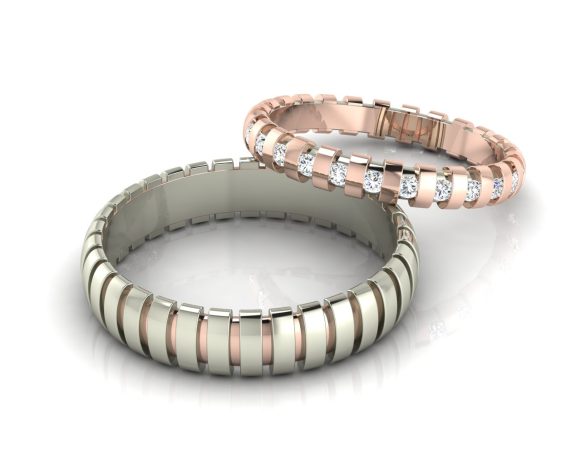 Pár designových snubních prstenů pro muže a ženu z růžového a bílého zlata, dámský prsten doplněn o diamanty. Kolekce Orbital šperkaře M. Kadaníka.